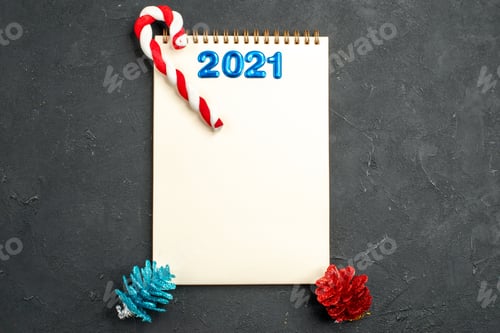 Preview: top view writing on notepad on dark background xmas new year photo color