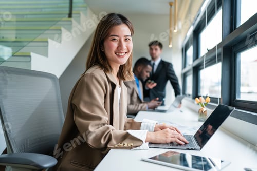 Preview: Successful businesswoman working at her office desk.