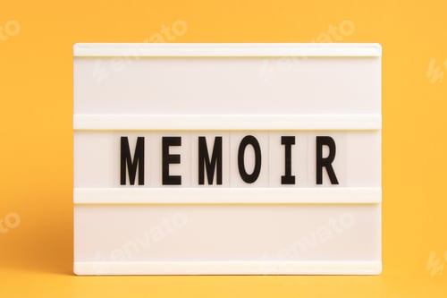Preview: The word memoir on lightbox isolated yellow background