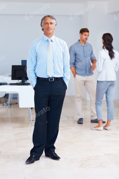 Preview: Confident business man with colleagues