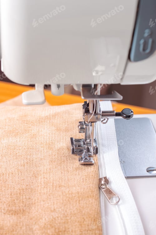 Preview: Modern Sewing Machine Special Presser Foot With Beige Velveteen Fabric And Zipper, Closeup