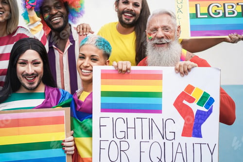 Preview: Multiracial gay people having fun at pride parade with LGBT flags and banners outdoors