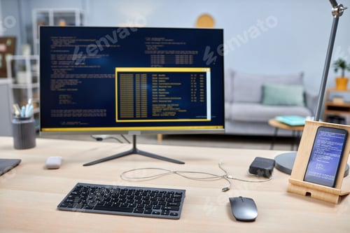Preview: Close up of smartphone with code lines on IT developers workplace