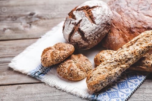 Preview: Delicious fresh bread on wooden background