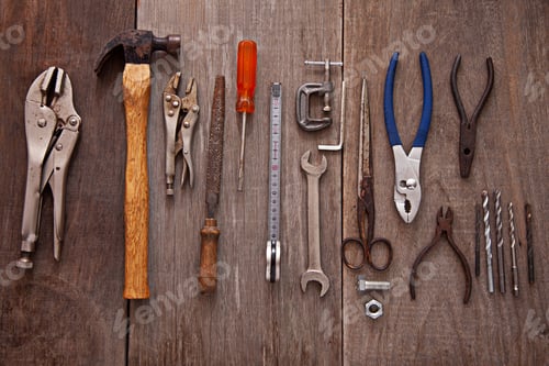 Preview: Set of tools on a wooden board in a workshop