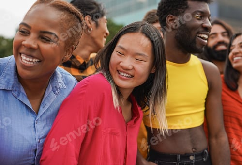 Preview: Crowd of multiracial people having fun hugging each other in the city