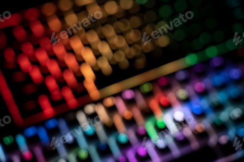 Preview: top view out of focus image of illuminated RGB keyboard in the dark
