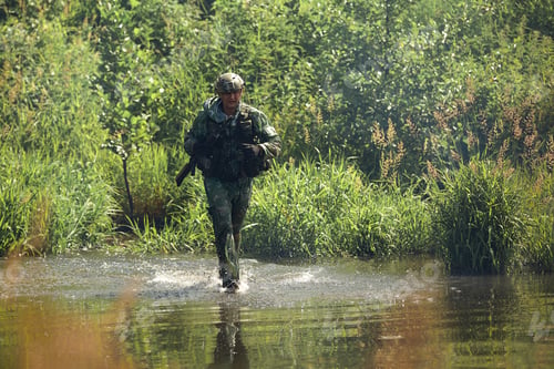 Preview: Full military experience - One day commando - running through the water with automatic rifle replica