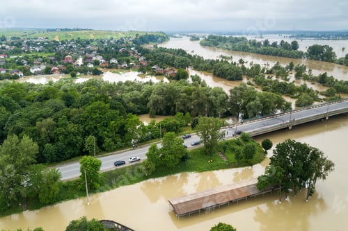 Preview: Aerial view of flooded houses with dirty water of Dnister river in Halych town, western Ukraine