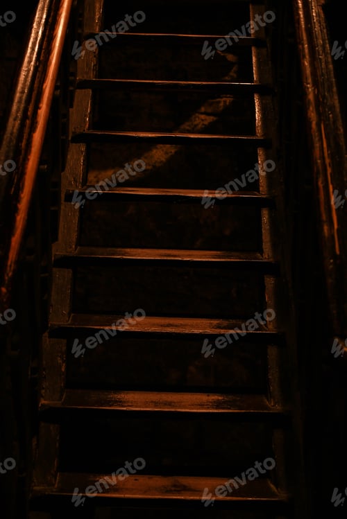Preview: Dark Staircase with Wooden Handrails in Dim Light