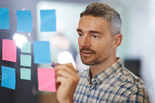 Preview: He looks closely to spot any mistakes