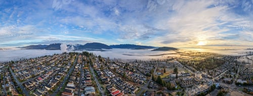 Preview: Sunrise Fog Over Residential Neighborhood and Mountains in Burnaby, BC, Canada — Aerial Panorama