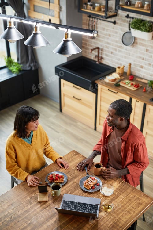 Preview: Couple Enjoying Breakfast in Kitchen