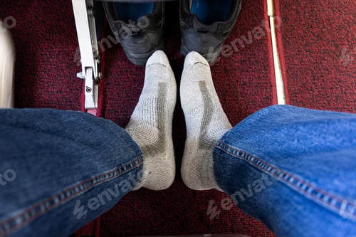 Preview: Airplane passenger removed shoes in cabin to relax feet during long haul flight