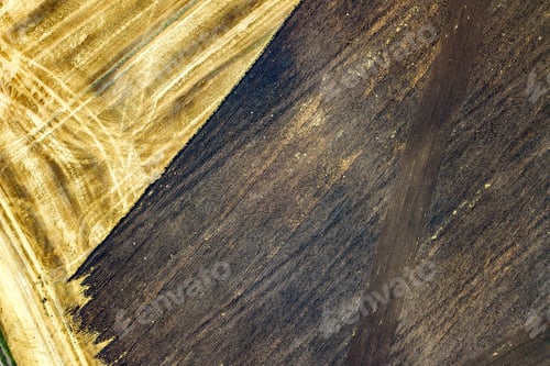 Preview: Aerial view of plowed agricultural field prepared for planting crops in spring