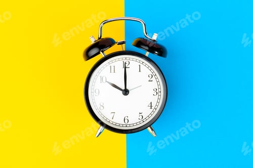 Preview: Black alarm clock on color block yellow and blue background