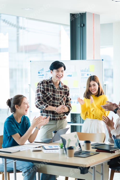 Preview: Successful business people present analytics reports while working with colleagues in the modern off
