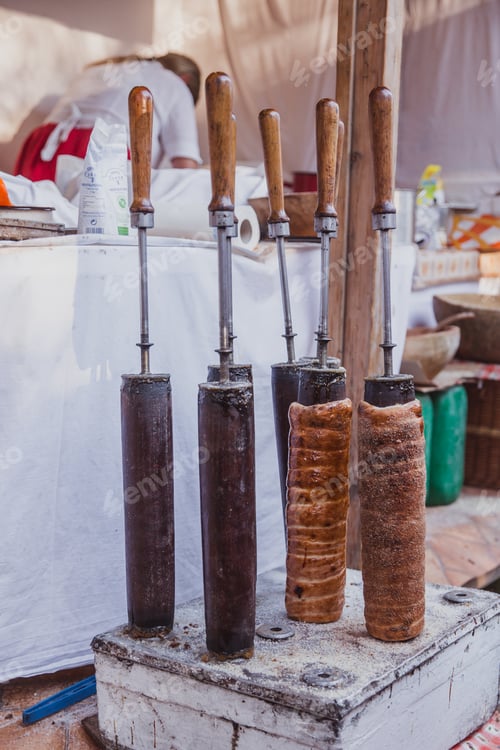 Preview: The baking of Kurtoskalacs, the traditional hungarian spit cake, in a pastry shop. Festival