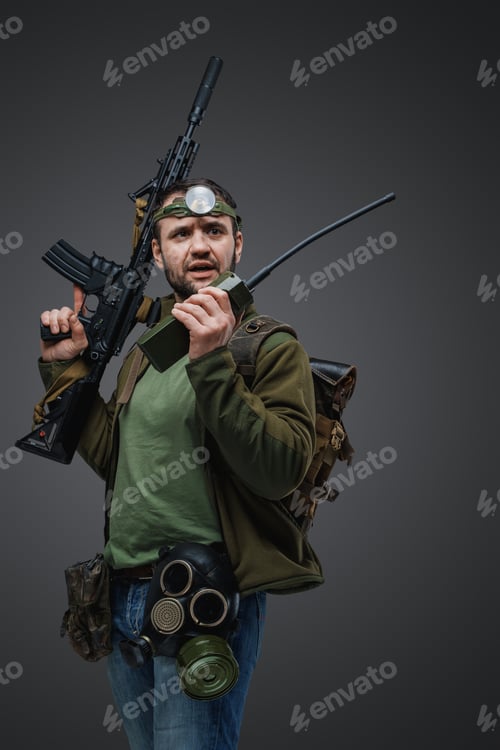 Preview: Post apocalyptic survivor man with walkie talkie and rifle