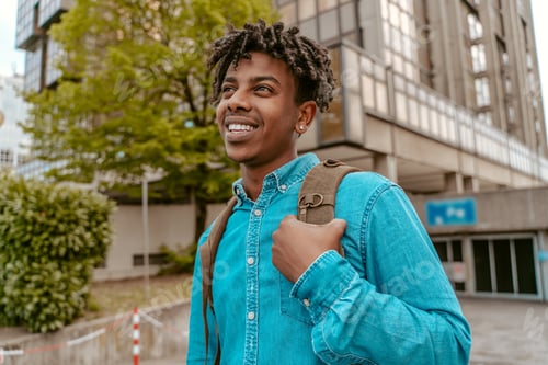 Preview: Smiling man walking on city street