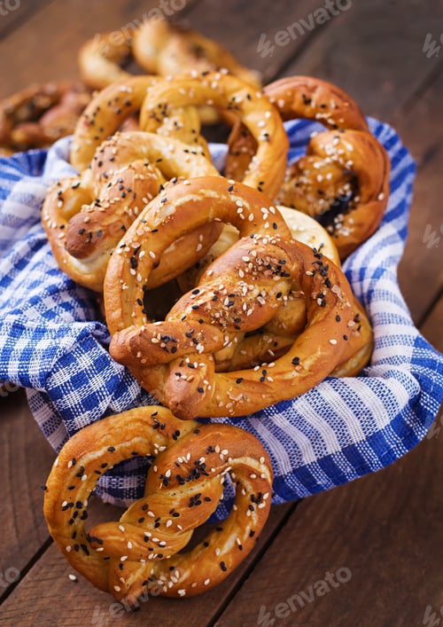 Preview: Oktoberfest salted soft pretzels in a bowl from Germany on wooden background