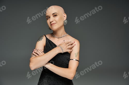 Preview: Elegant bald woman showcases confidence and beauty in a stunning fashion portrait indoors