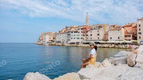 Preview: A tranquil moment by the waterside in Rovinj, Croatia amidst colorful historic buildings