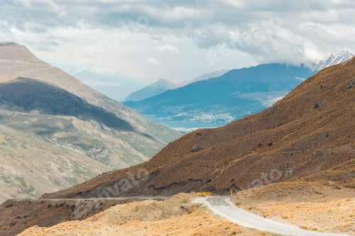 Preview: Straight empty highway leading into Aoraki-Mount Cook National Park to the highest peaks