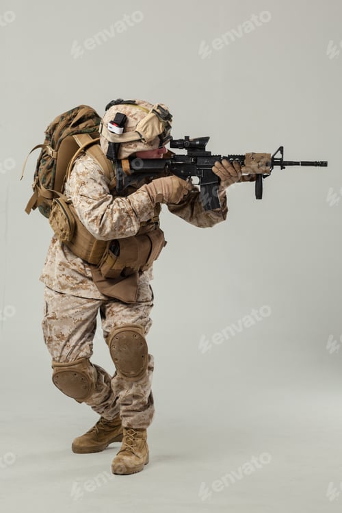 Preview: Soldier in military gear aims weapon during training in controlled setting