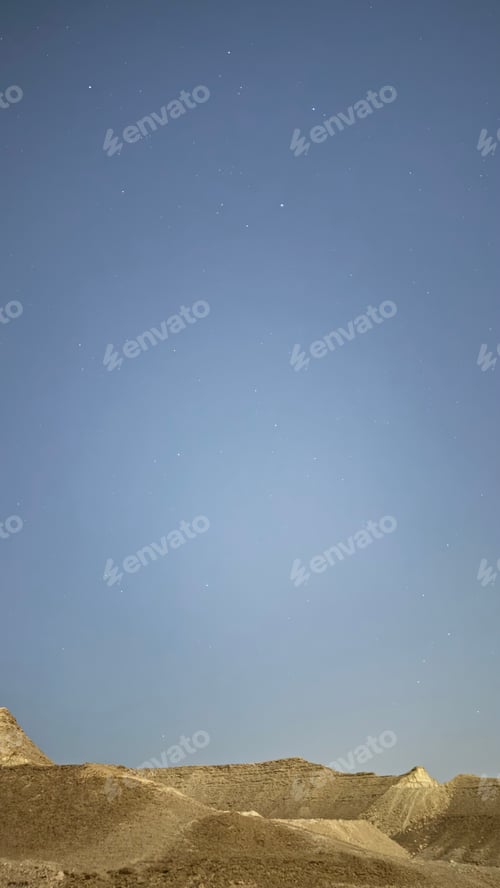 Preview: Night sky over a barren desert landscape, sparkling with stars