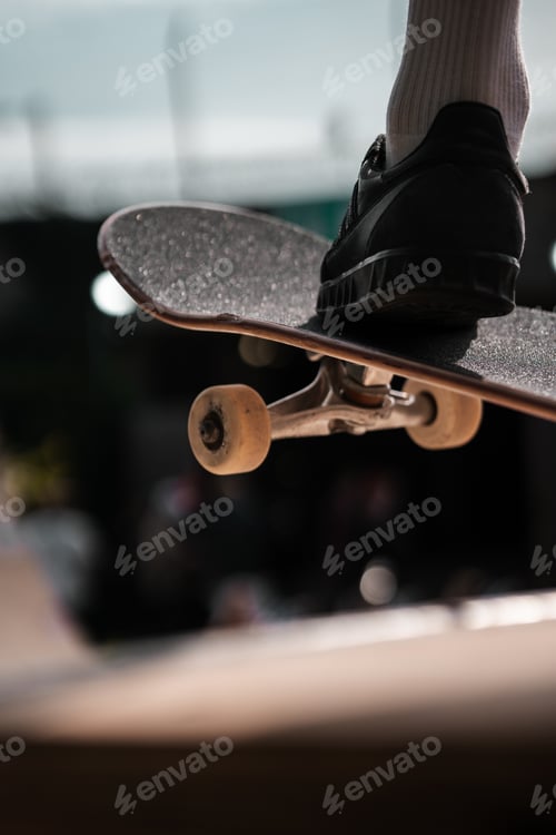 Skateboarder's Foot on Board in Urban Skate Park