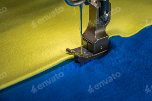 Preview: Professional sewing machine with yellow and blue fabric