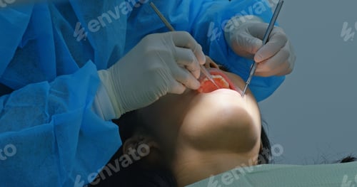 Preview: Woman under dental check up in clinic
