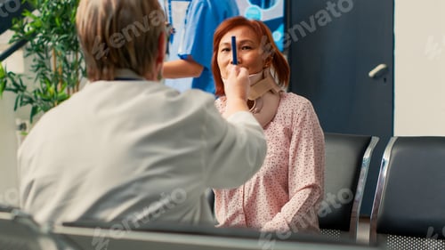 Preview: Physician doing consultation with asian woman in hospital lobby