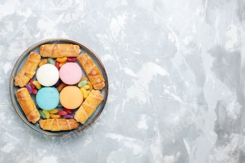 Preview: top view sweet bagels with macarons on white background sweet bake pie sugar