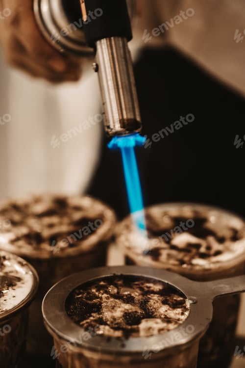 Preview: Person Caramelising the sugar on a Bubble tea