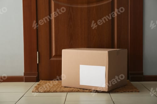 Preview: Parcel on rug near door. Delivery service
