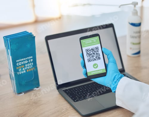 Preview: Covid, vaccine and passport on smartphone for travel, safety or security during virus pandemic. Lap