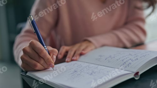 Preview: Accountant hands writing notebook at light workplace closeup. Woman making notes