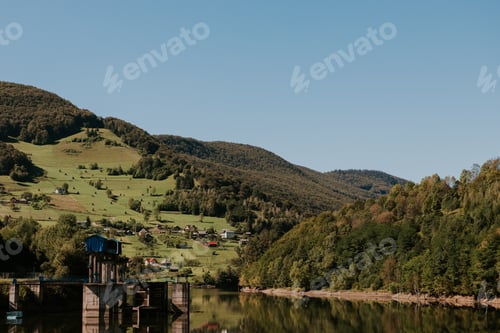 Preview: Amazing landscape of a lake, mountains and a village