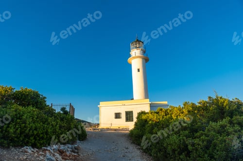Preview: Detail of the white lighthouse or Cape Ducato Lefkas at sunset in the southern area Lefkada. Greece.