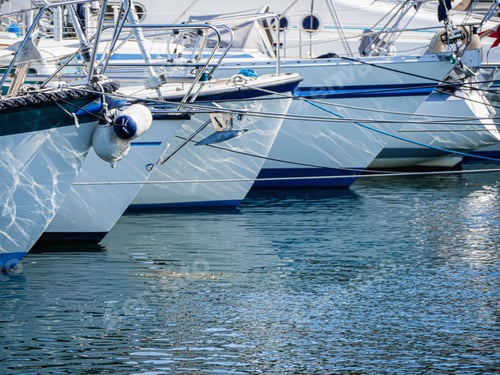Preview: Closeup shot of white boats sailing on the water