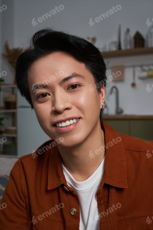 Preview: Relaxing moments in a modern apartment with a cheerful young man