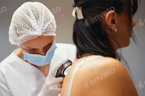 Preview: A dermatologist examines the skin.