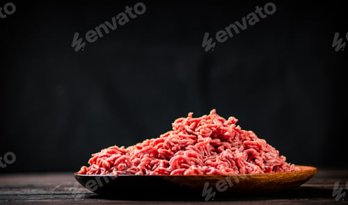 Preview: Fresh minced meat on the table on a plate.