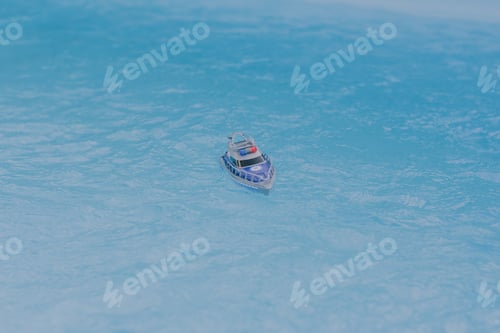 Preview: Toy / lego police boat in the water.