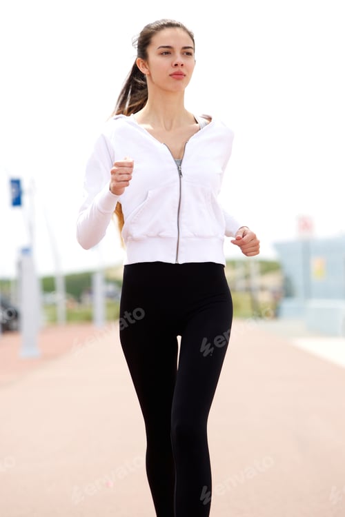 Preview: Young female runner outside
