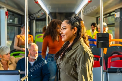Preview: Young woman smiling while commuting on public bus