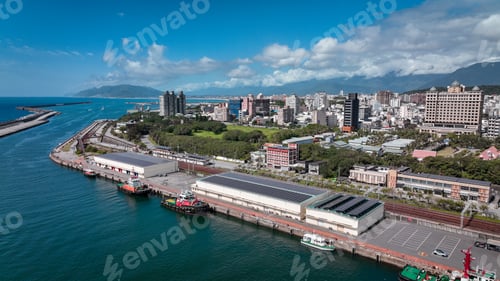 Preview: Aerial view of Hualien harbor and cityscape showcasing vibrant waterfront life in Taiwan