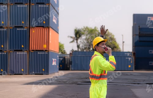 Preview: Workers in the import and export industry use walkie talkies to communicate with drivers